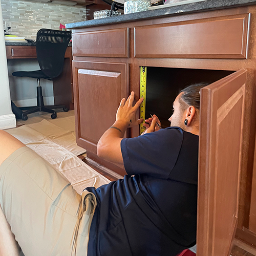 Part of the custom design process is to get precise measurements of your cabinetry so our slide out shelves fit perfectly.